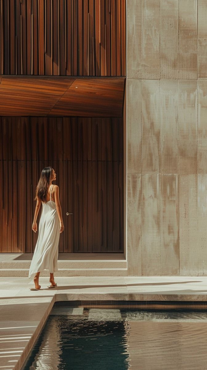 A person walking through a warm architectural space